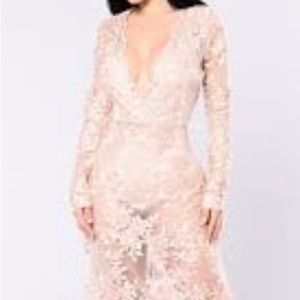 Pink embroidered faux wrap gown.